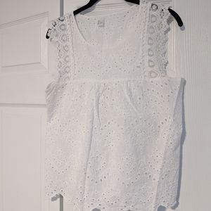 Sleeveless white eyelit top